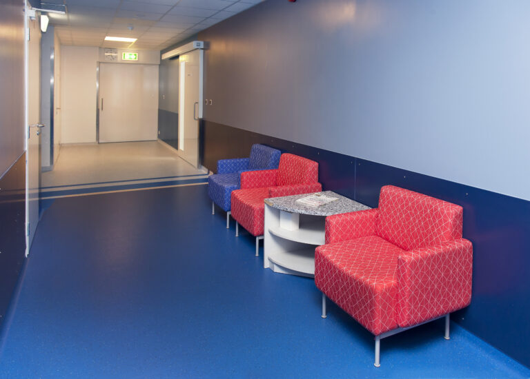 Corridor and waiting areas of a modern hospital with seating
